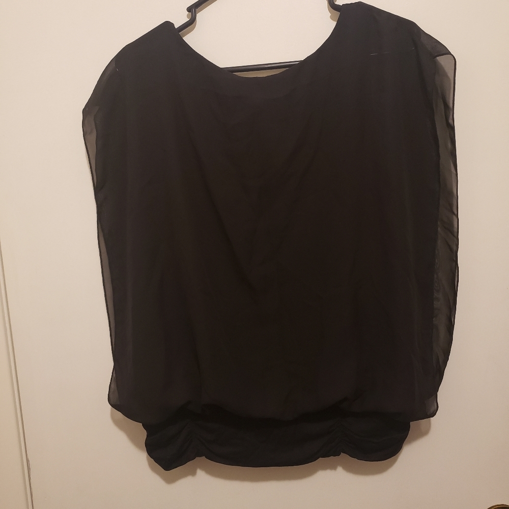 Black sleeveless blouse with sheer overlay
